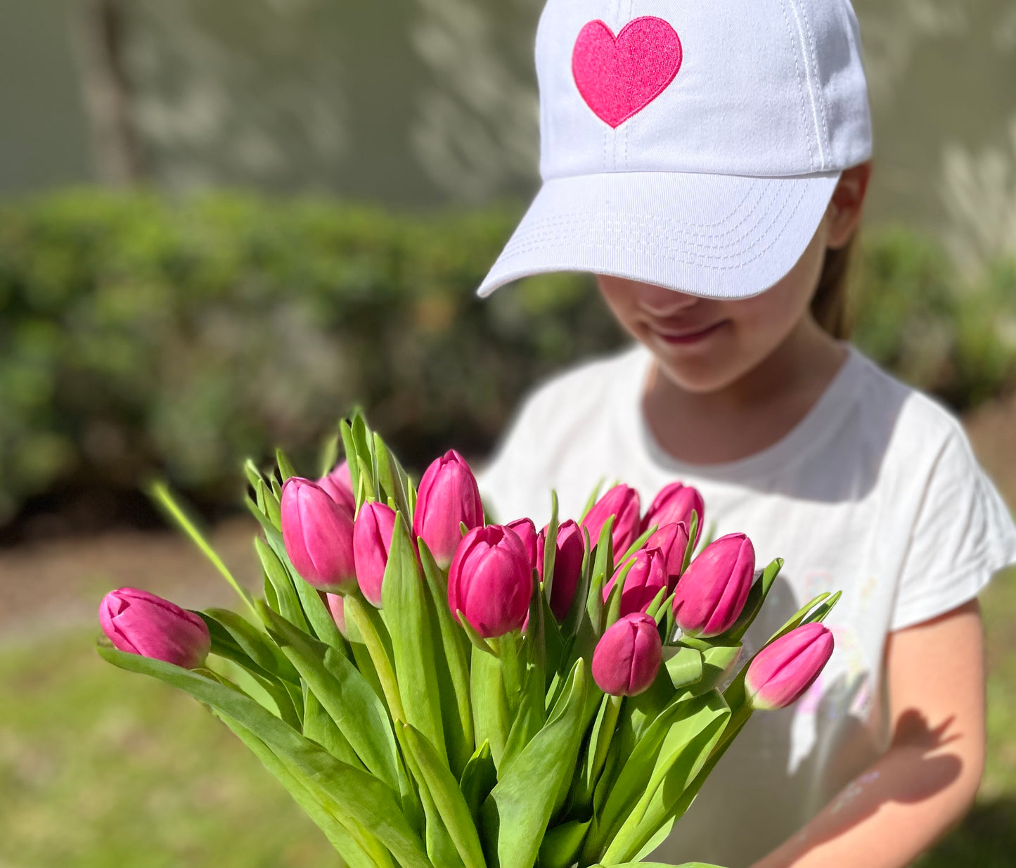 A girl using our Heart Cap