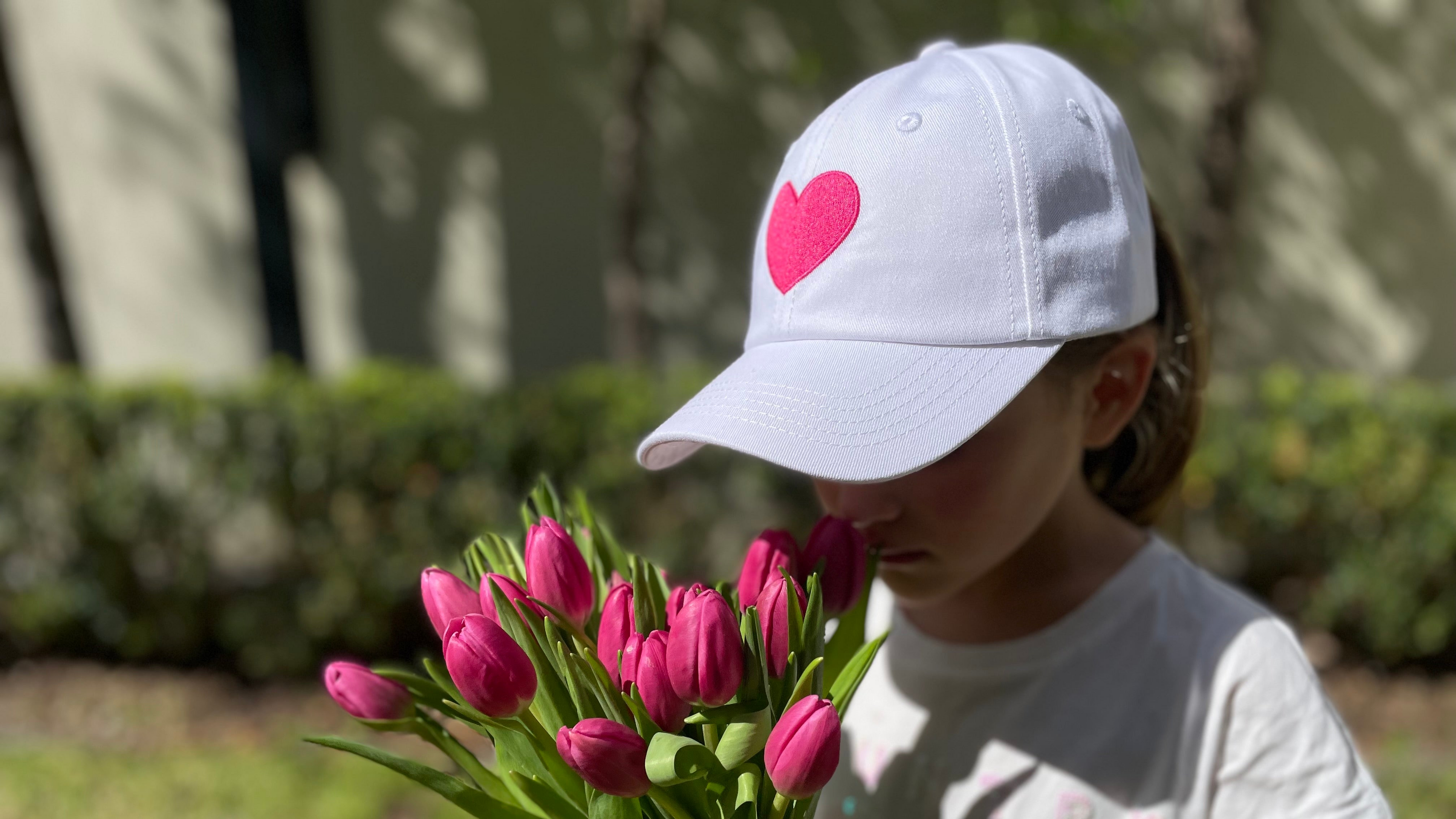 a girl using the Heart Cap